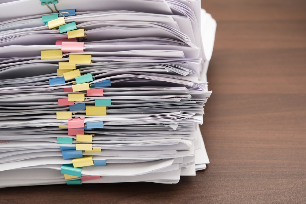 stack of paper the Benefits of Contract Management