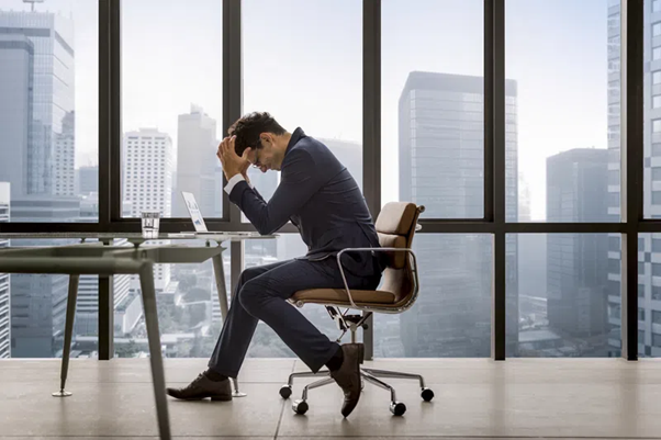 procurement challenges, man holding head